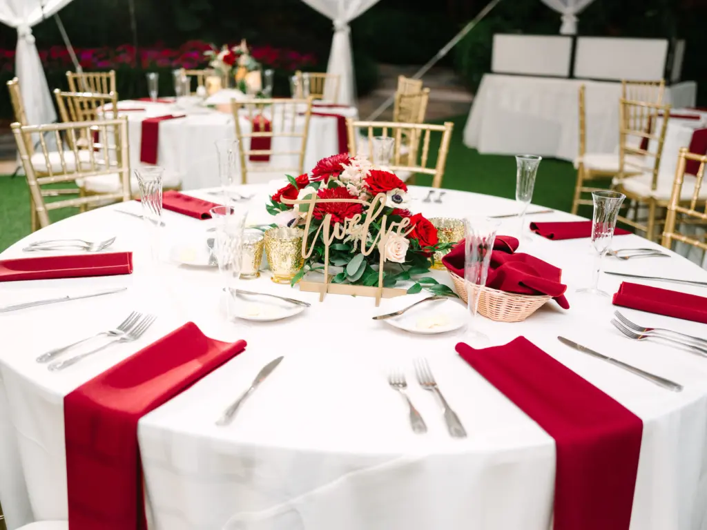 White and Red Christmas Inspired Wedding Reception Decor Ideas | Laser Cut Table Numbers | Red Rose, White Anemone Centerpiece Inspiration | Tampa Bay Planner WilderMind Events | Caterer Amici's Catering