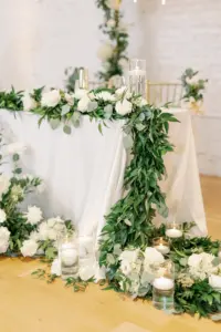 Romantic White Gold and Greenery Sweetheart Table with White Linens Wedding Inspiration