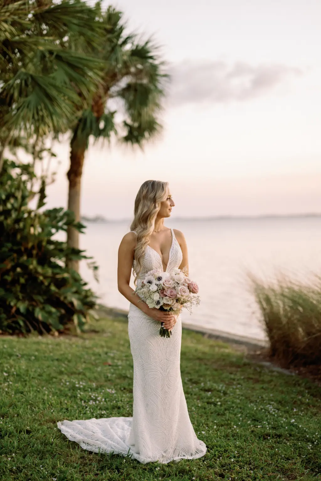 Bride Sunset Wedding Portrait in Made With Love Bridal Dress | Waterfront Sarasota Private Mansion Venue Powel Crosley Estate | Photographer Dewitt For Love Photography