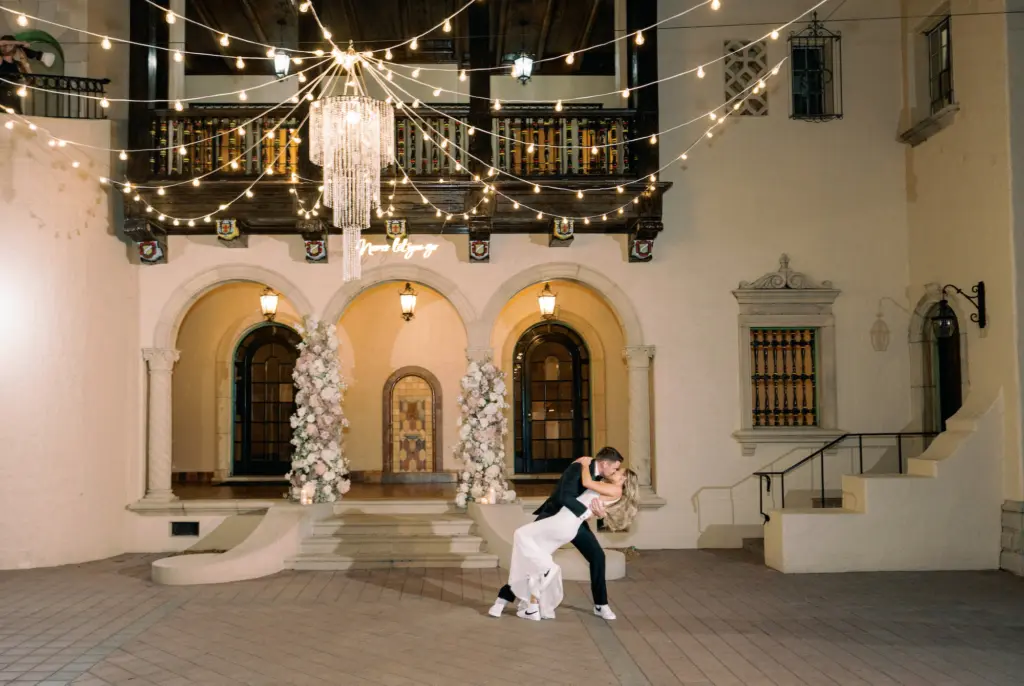 Bride and Groom Dancing Under the String Lights at Wedding Reception | Sarasota Photographer Dewitt for Love Photography | Sarasota Private Mansion Venue Powel Crosley Estate