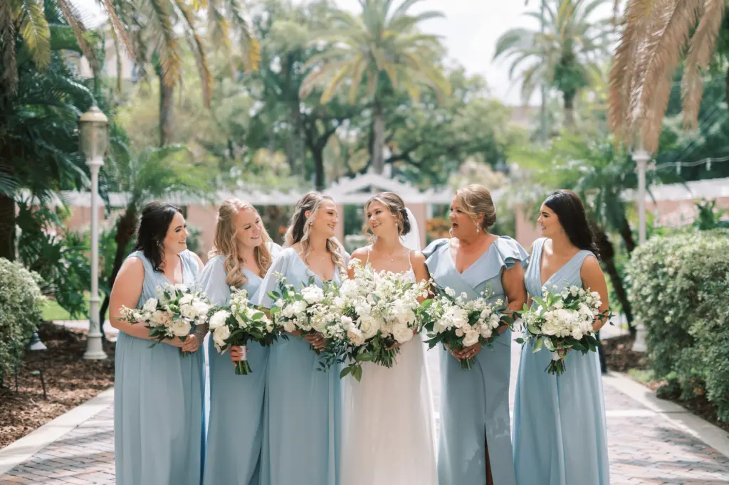 Mismatching Pastel Blue Revelry Bridesmaids Wedding Dress Ideas | White Baby Roses, Stock Flowers, and Greenery Bouquet Inspiration