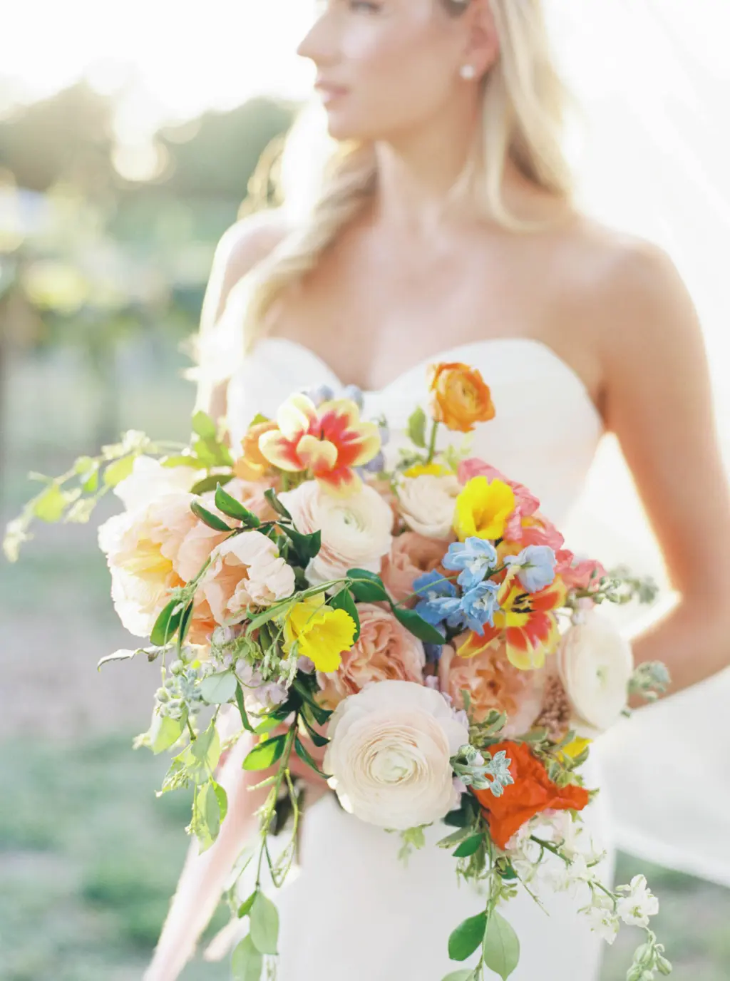 Colorful Spring Wildflower Bridal Wedding Bouquet Inspiration | Bride Bouquet with Peach Ranunculus, Blush Garden Roses, Orange Tulips and Yellow Daffodils | Sarasota Florist Save The Date Florida