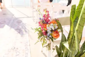 Pink, Orange, and Cream with Greenery Wedding Florals Decor with White Folding Chair Ceremony Inspiration