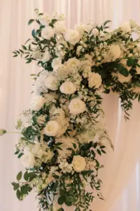 Classic Romantic Monochromatic Floral Arrangement for Wedding Ceremony Arch | Garden Roses, Stock Flowers, and Greenery