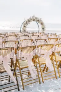 Floral Circle Arch in Boho Beach Wedding Ceremony with Wooden Folding Chairs and Pink Bow Organza Ribbons Ideas