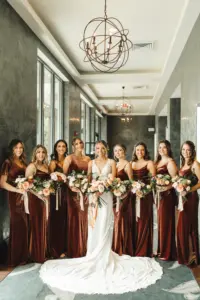 Bride with Bridesmaids Wedding Portrait | Floor Length Rust Terracotta Velvet Fall Bridesmaids Dress Inspiration | Tampa Hair and Makeup Artist Femme Akoi Beauty Studio