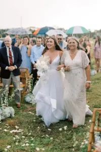 Bride and Mother Walking Down Wedding Aisle