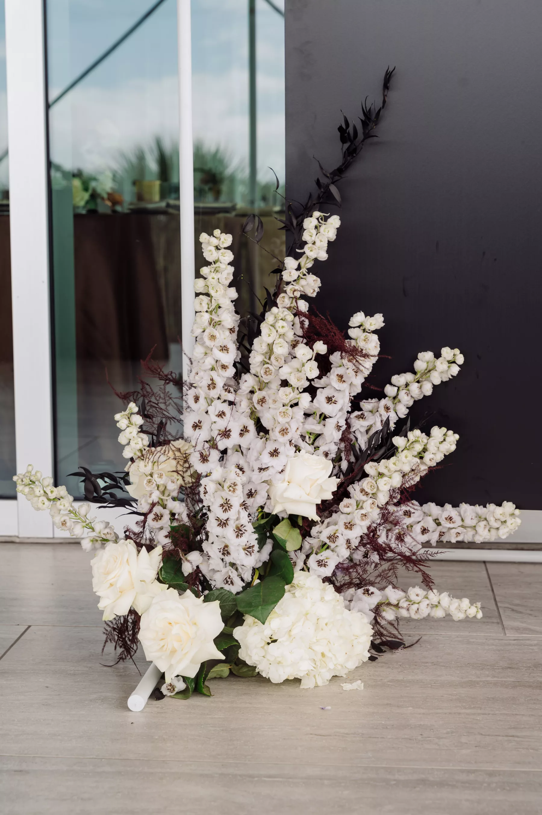White Roses, Hydrangeas, delphinium, and Purple Fern Wedding Reception Decor Inspiration