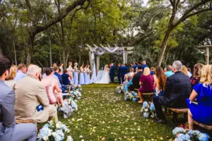 Rustic Outdoor English Garden Bridgerton Wedding Ceremony Inspiration | Blue Hydrangeas and Stock Flowers, White Roses and Wine Barrel Aisle Decor Ideas | Bench Seating, Pergola Arch | Tampa Bay Event Venue Tabellas At Delaney Creek | Tampa Event Planner B Eventful