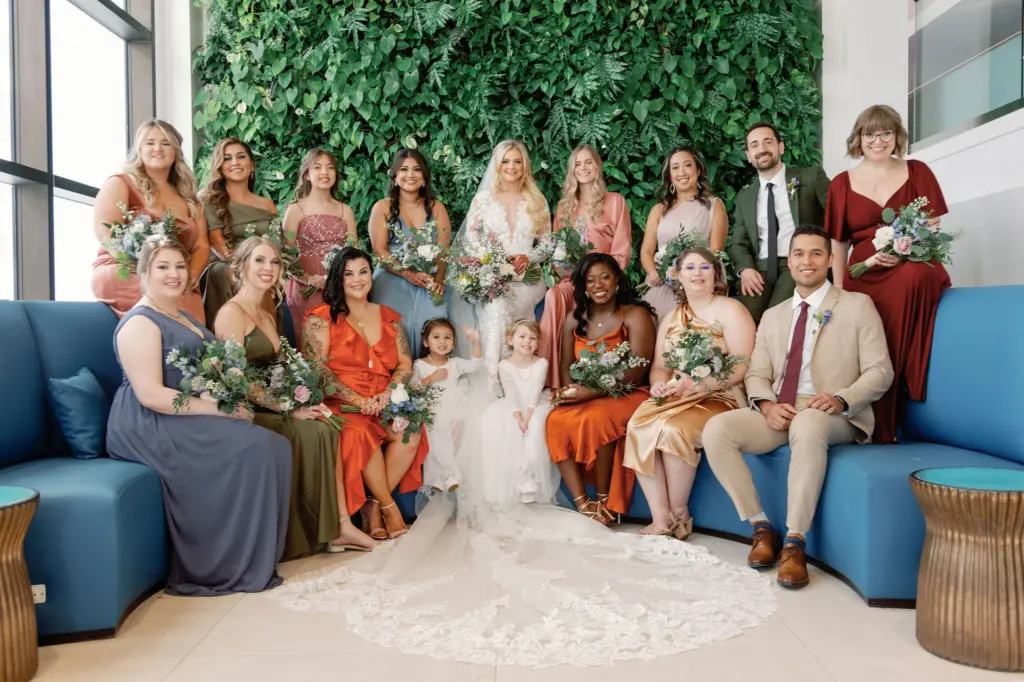 Large Bridal Party Wearing Mismatching Dusty Blue, Orange, Rose, Maroon, Olive Green, and Khaki | Colorful Wedding Party Inspiration