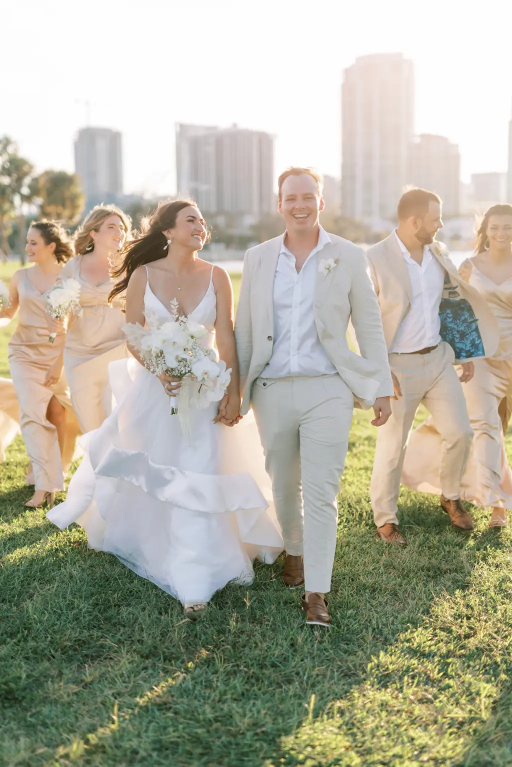 Bride and Groom Just Married Sunset Wedding Portrait | Satin Cream Champagne Bridesmaid Dress Inspiration | White Spaghetti Strap Open Back A-Line Layered Tulle Hayley Paige Bridal Wedding Dress Ideas