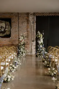 Asymmetrical Wedding Ceremony Flower Arch and Aisle Decor Ideas with Blue Stock Flowers, Yellow Hydrangeas, Pink Chrysanthemums, and Greenery | Tampa Venue Hotel Haya