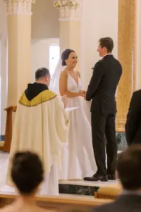 Bride and Groom Exchange Vows in Church Wedding Ceremony at the Alter Portrait