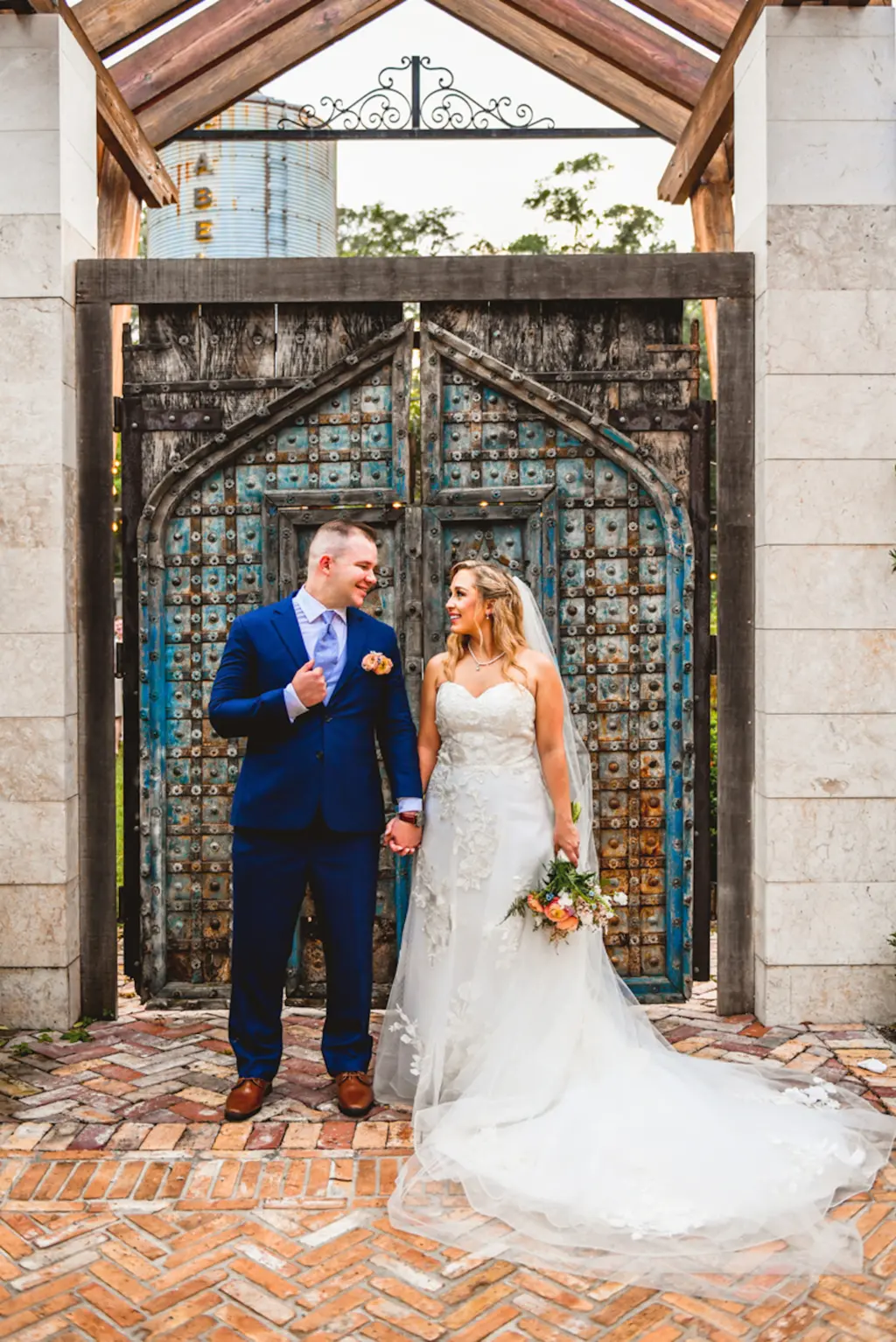 Bride and Groom Just Married | Ivory Strapless Tulle and Lace A-Line Wedding Dress Inspiration | Navy Suit with Blue Tie Ideas | Tampa Bay Event Venue Tabellas at Delaney Creek