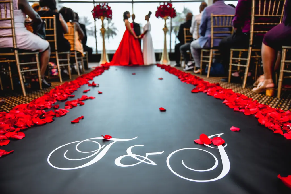 Black and White Calligraphy Initial Monogram Wedding Ceremony Black Aisle Runner With Red Rose Petals Wedding Decor Inspiration | Tampa Wedding Planner UNIQUE Weddings + Events 