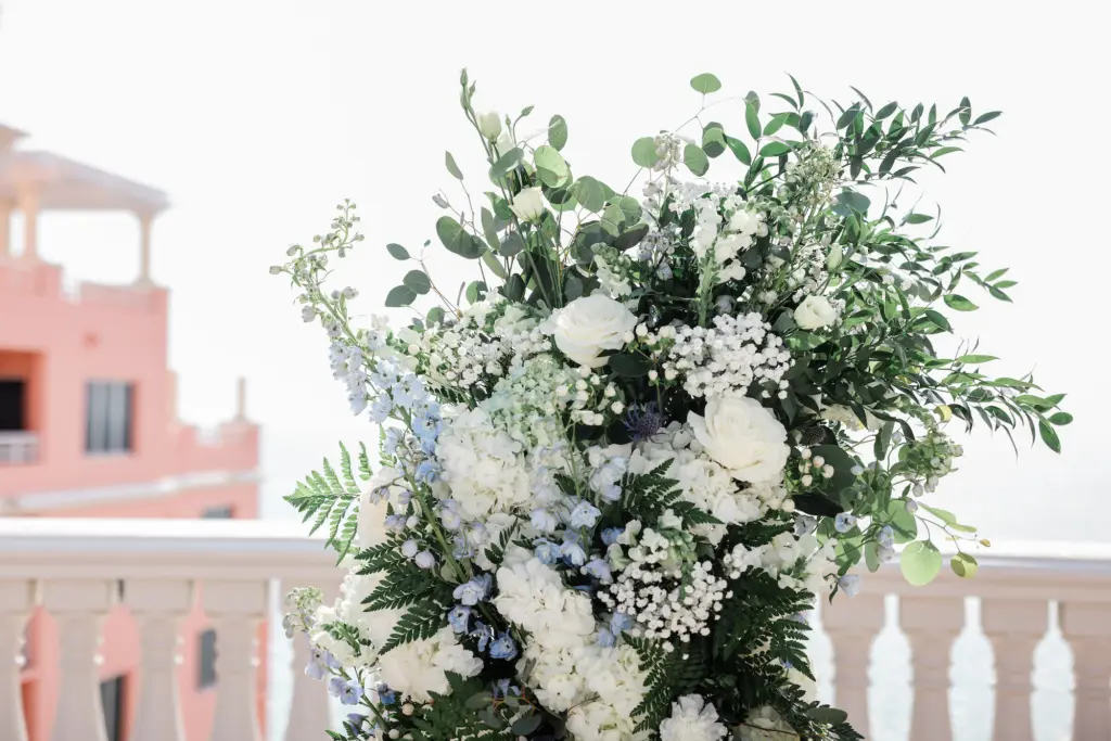 White Roses, Baby's Breath, Hydrangeas, Blue Delphinium, and Greenery Wedding Ceremony Arch Decor Ideas