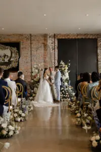 Bride and Groom Vow Exchange Wedding Portrait | Pastel Spring Wedding Ceremony Ideas | Tampa Bay Event Venue Hotel Haya | Ybor City Planner Coastal Coordinating