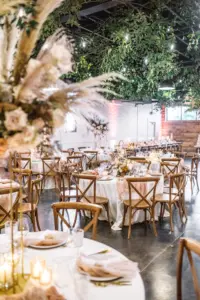 Wooden Crossback Chairs with Dried Floral Boho Wedding Decor with Circle Tables | St. Petersburg Wedding Venue The West Events | Tampa Event Caterer Olympia Catering