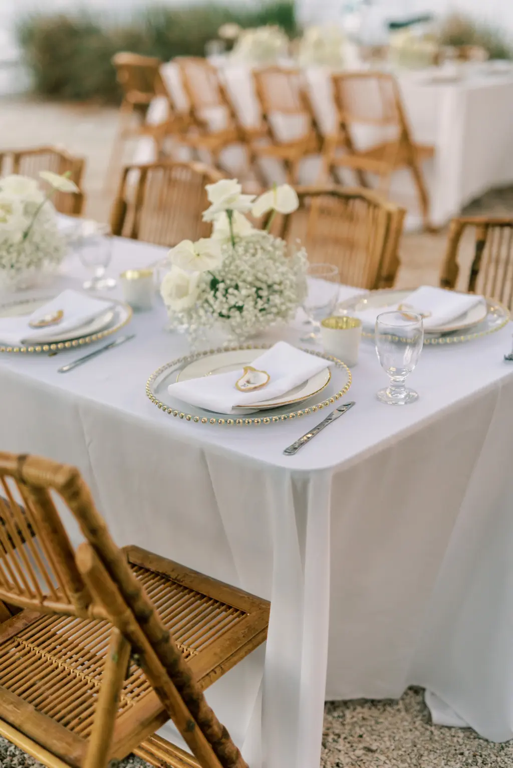 Oyster Place Card Decor Inspiration | Blue, Gold, and Cream Coastal Boho Wedding Reception Tablesetting with Wooden Bamboo Rattan Chair Ideas