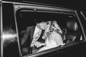 Bride and Groom in Getaway Car Black and White Wedding Portrait