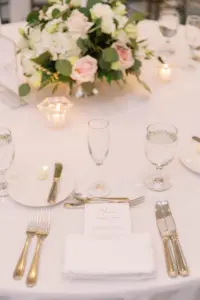 Classic Timeless Place Setting with Blush and Cream Floral Centerpiece and White and Silver Flatware | Elegant Wedding Reception Ideas