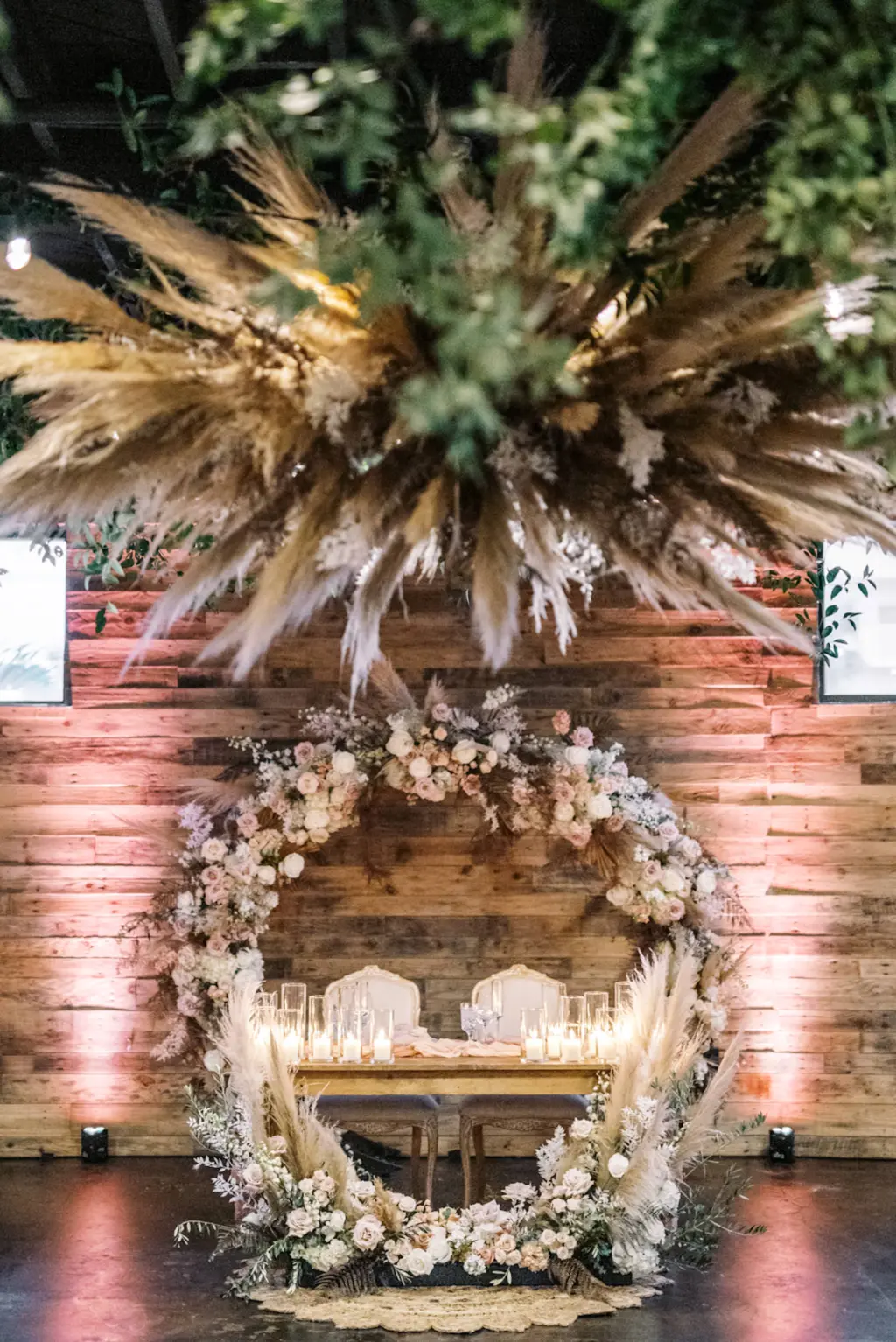 Boho Floral Sweetheart Table with Dried Florals and Candle Decor | St. Petersburg Wedding Venue The West Events