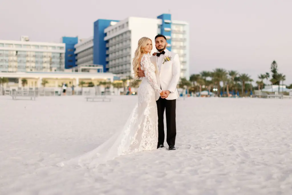 Bride and Groom on Clearwater Beach Sunset Wedding Portrait | Tampa Venue Hilton Clearwater Beach | Planner Coastal Coordinating