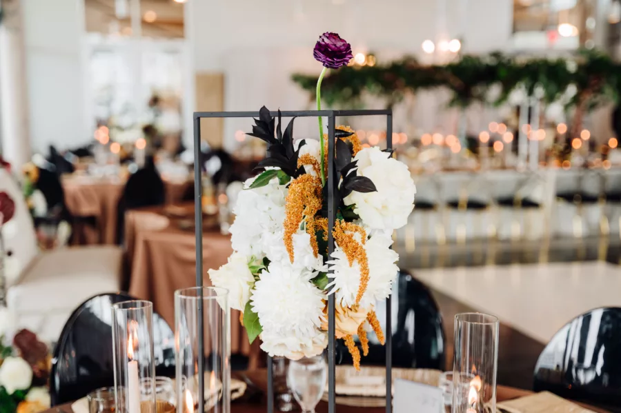 Modern Bronze Wedding Reception Centerpiece Inspiration | Brown Anthurium, Orange and White Roses, and Greenery with Black Flower Stand Centerpiece Decor Ideas