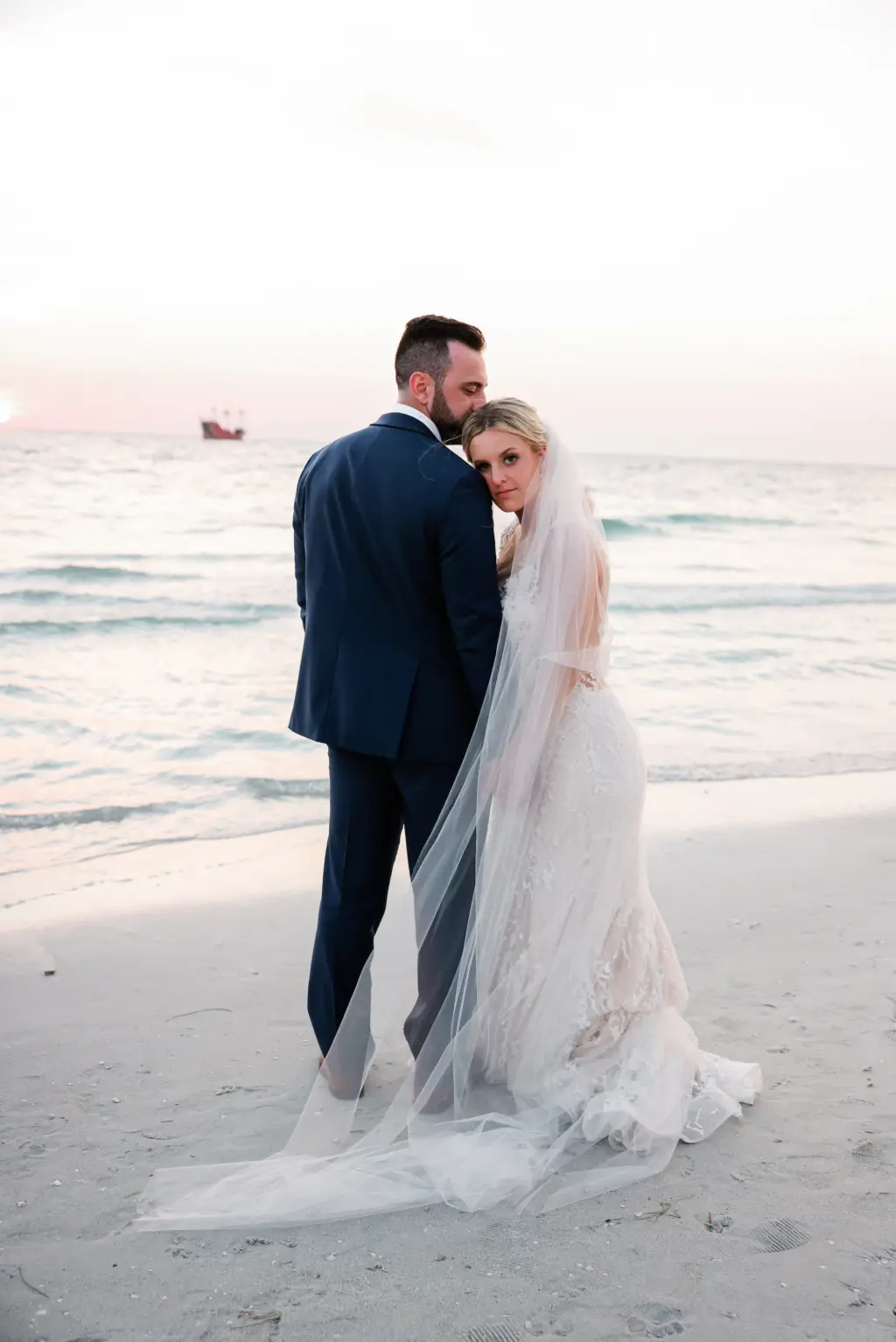 Bride and Groom Clearwater Beach Sunset Wedding Portrait | Tampa Bay Photographer Lifelong Photography Studio | Venue Hyatt Regency Clearwater Beach | Planner Coastal Coordinating