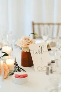 White and Black Table Number Signs with Terracotta Flower Vases | Fall Rust Wedding Reception Decor Ideas
