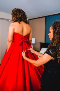 Bride Getting Ready Wedding Portrait in Strapless Red Ballgown Wedding Gown with Bow Detail | Tampa Wedding Dresses Truly Forever Bridal
