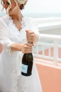 Bride Celebrating Wedding Day with Champagne