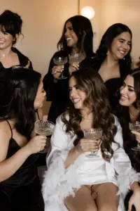 Bride and Bridesmaids Champagne Celebration on Wedding Day