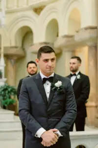 Groom Watching Bride Walking Down Aisle | Classic Black Tux Wedding Ceremony Inspiration