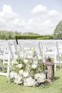 Elegant Outdoor Wedding Ceremony on Event Lawn | White Garden Chairs | White Hydrangeas, Roses, and Greenery Aisle Decor Ideas | Tampa Bay Event Venue The Concession Golf Club | Sarasota Florist Beneva Flowers and Plantscapes
