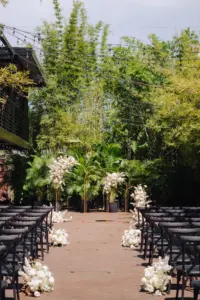 Gold Metal Hoop Arches | Black Crossback Chairs for Great Gatsby Inspired Wedding Ceremony | Monochromatic Floral Aisle Decor Inspiration | Bamboo Garden at St Pete Event Venue Nova 535 | Tampa Bay Florist Marigold Flower Co.