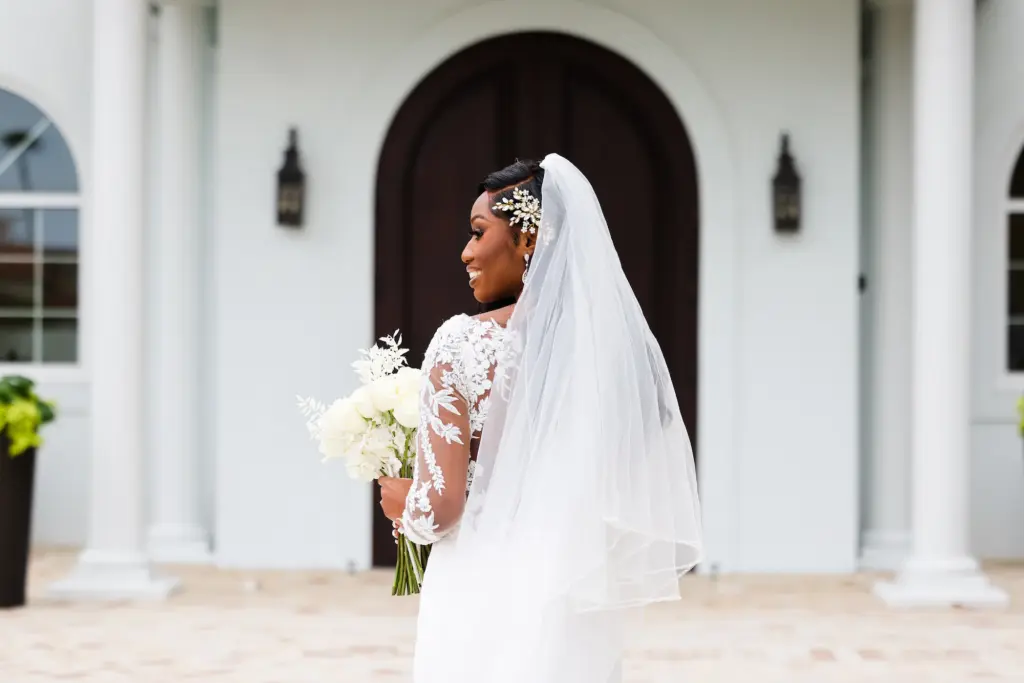 Sheer Lace Long Sleeve Fit and Flare Wedding Dress Ideas | Flower Hairpiece and Beaded Veil Inspiration | Monochromatic White Rose, and Italian Ruscus Bouquet | Tampa Photographer Lifelong Photography Studio