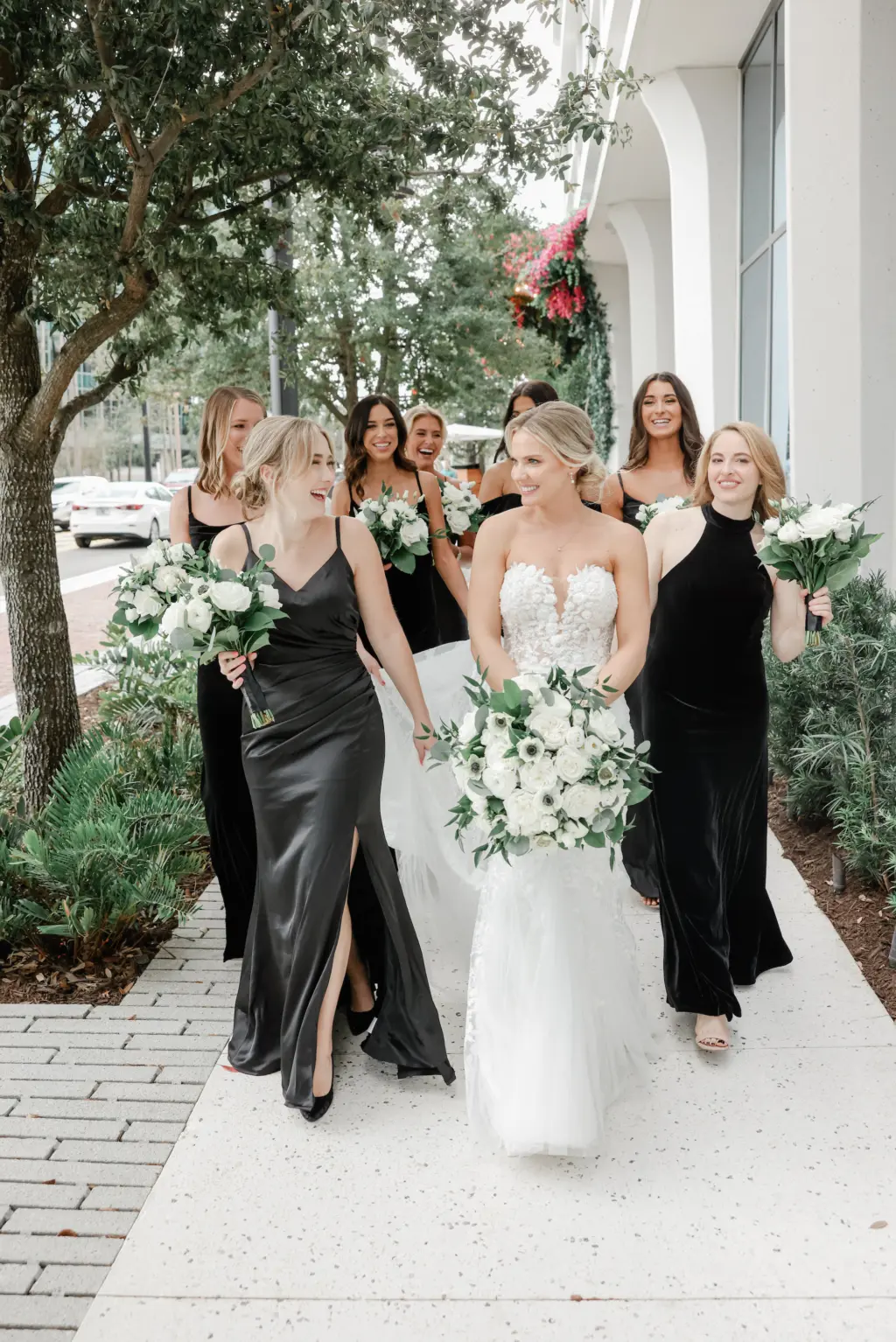 Bride and Bridesmaids Walking Through Downtown Tampa Water Street Wedding Portrait