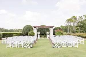 Elegant Outdoor Event Lawn Wedding Ceremony Decor Inspiration | White Folding Garden Chairs | Sarasota Event Venue The Concession Golf Club | Florist Beneva Flowers and Plantscapes