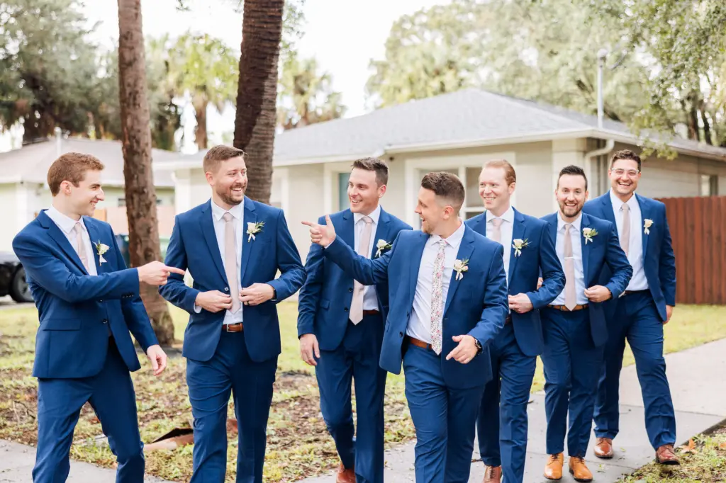 Groom and Groomsmen Navy Wedding Suits with Floral and Pink Ties Inspiration