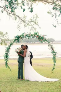 Round Arch with Greenery and Pink Roses Inspiration | Elegant Lakeside Wedding Ceremony Ideas | Tampa Bay Photographer Rachel Elle Photography | Planner The Olive Tree Weddings | White Lace Fit and Flare Morilee Wedding Gown