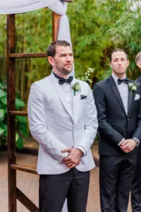 Groom's Reaction to Bride Walking Down Wedding Aisle | Black and White Tuxedo with Bow Tie Ideas