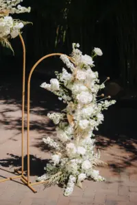 Gold Metal Hoop Arch with White Monochromatic Floral Arrangement for Modern Great Gatsby Inspired Wedding Ceremony