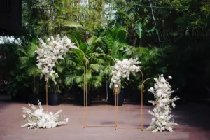 Gold Metal Hoop Arches with White Monochromatic Floral Arrangement for Modern Great Gatsby Inspired Wedding Ceremony | Tampa Bay Event Venue Nova 535 | St Pete Florist Marigold Flower Co