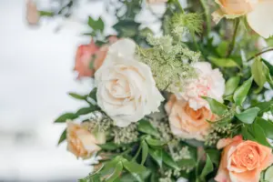 Pink, Peach, and Orange Roses with Greenery Wedding Ceremony Arch Flower Arrangement Ideas