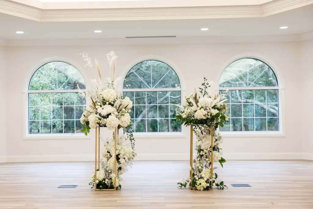 Tall Flower Stand with White Roses, Hydrangeas, Pampas Grass, Baby's Breath, and Greenery Decor for Wedding Ceremony Decor Ideas | Tampa Bay Venue Harborside Chapel