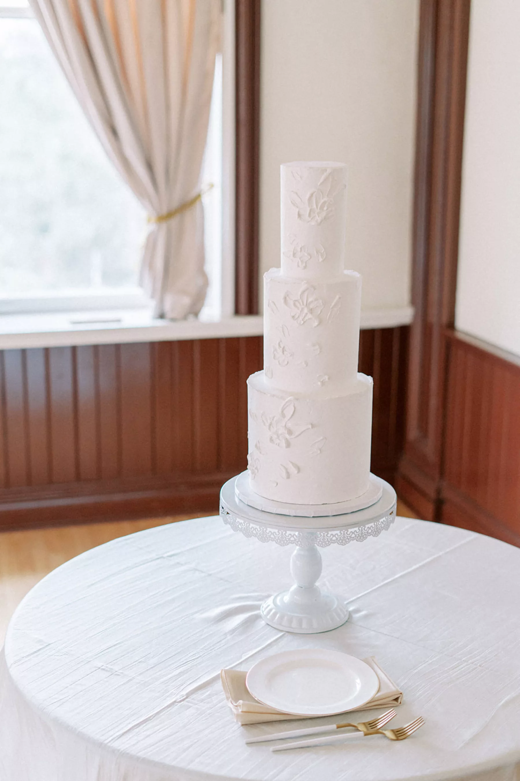 Modern Three-Tiered Round White Wedding Cake with Textured Icing Ideas