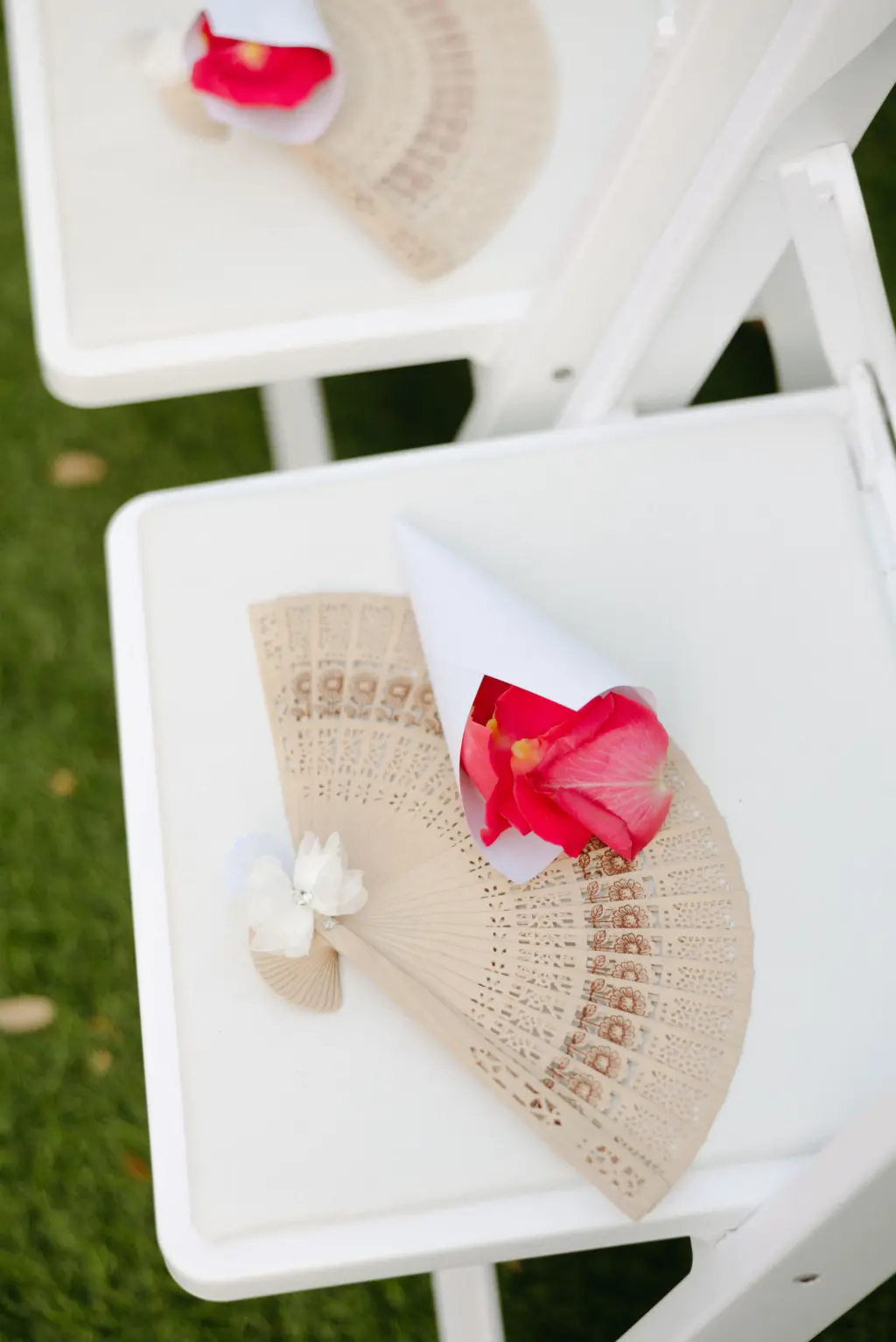Wedding Ceremony Fans and Throwing Petals for Guests on Folding Garden Chairs Ideas