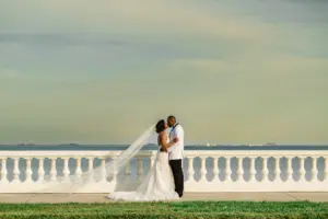 Bride and Groom Sunset on Bayshore Wedding Portrait Ideas | Tampa Photographer and Videographer Iyrus Weddings