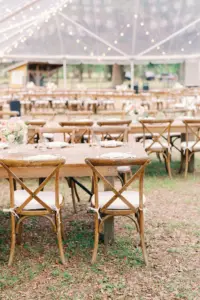 Rustic Wooden Chairs and Feasting Tables for Elegant Pink and White Clear Tented Outdoor Wedding Reception